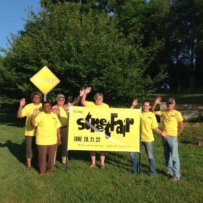 street fair sign with crew